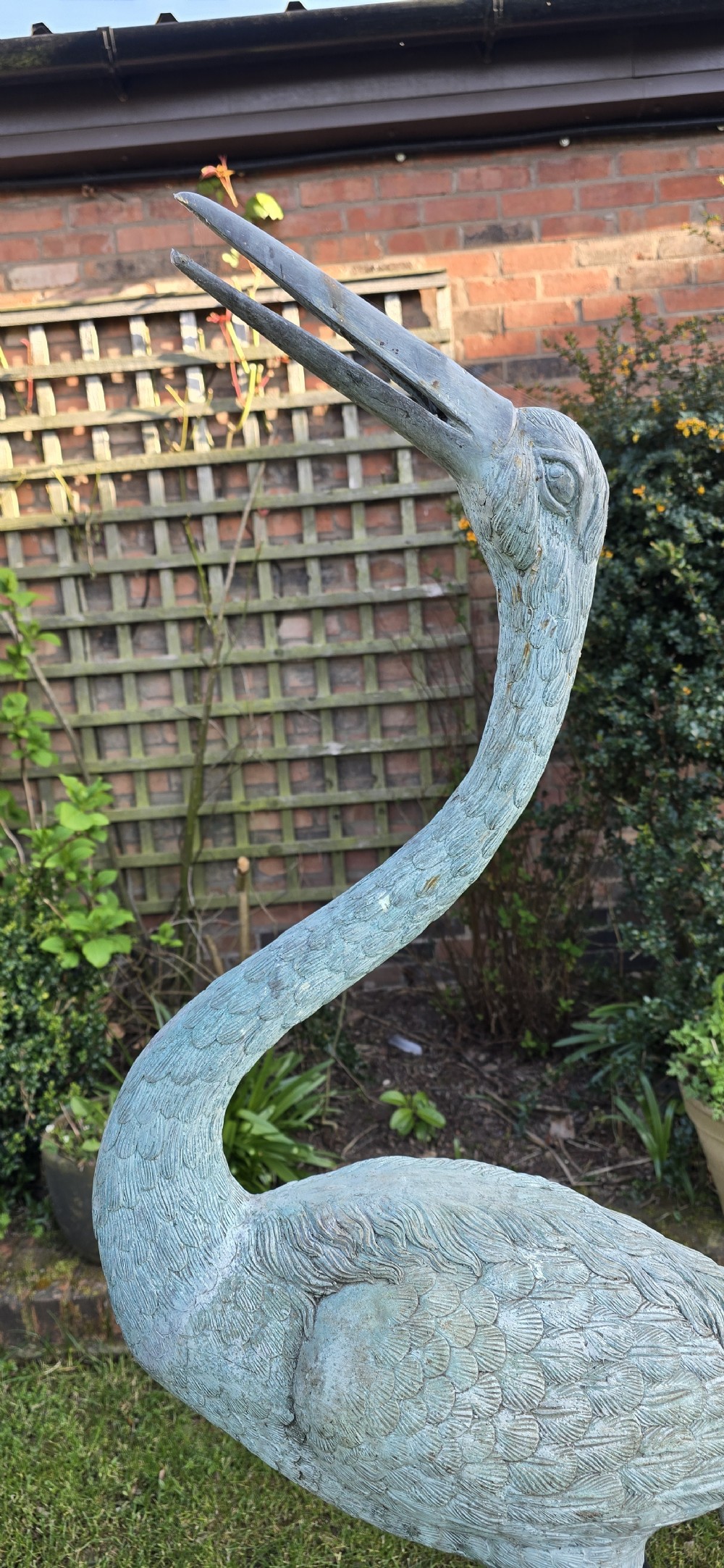 A pair of large cast metal crane statues featuring a weathered verdigris green finish and detailed feather texturing. View VIII