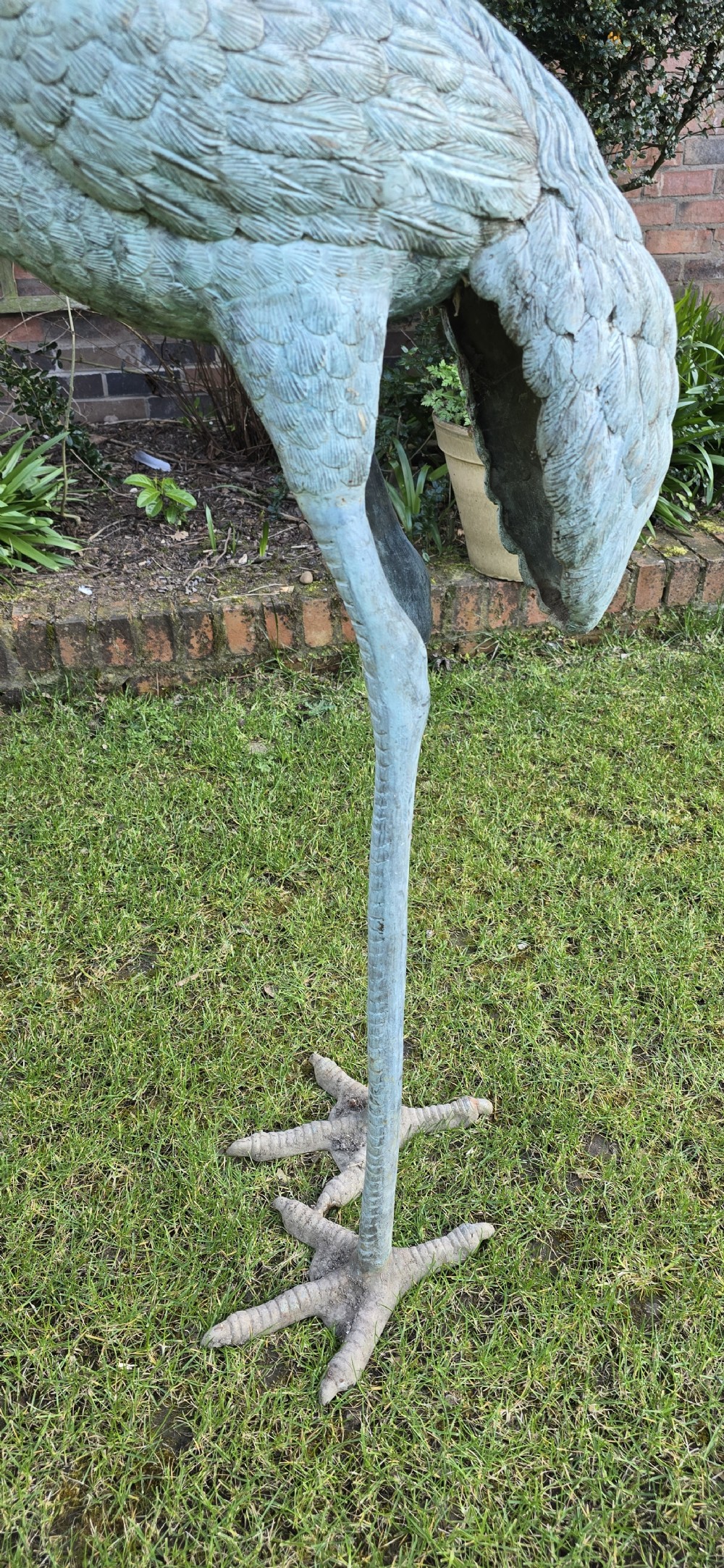 A pair of large cast metal crane statues featuring a weathered verdigris green finish and detailed feather texturing. View X