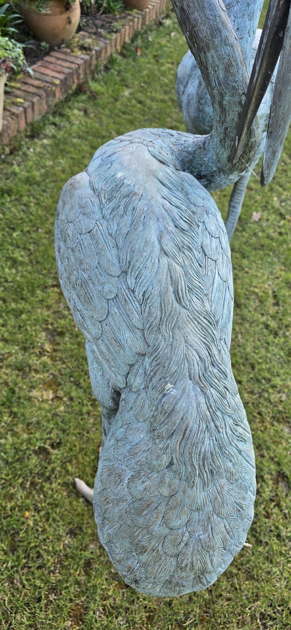 A pair of large cast metal crane statues featuring a weathered verdigris green finish and detailed feather texturing. View XII