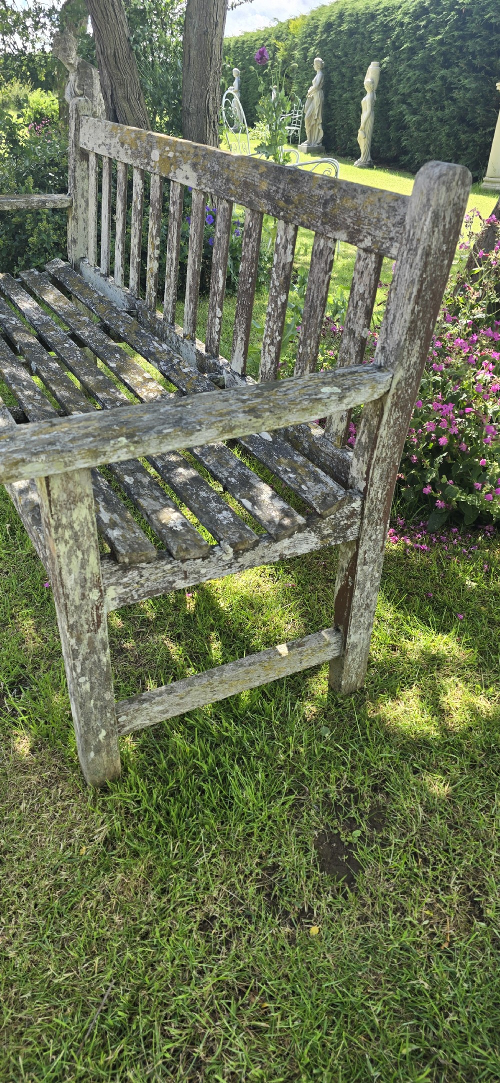 A rectangular slatted teak garden bench featuring a weathered grey oxidised finish, flat armrests, and square legs. View IX