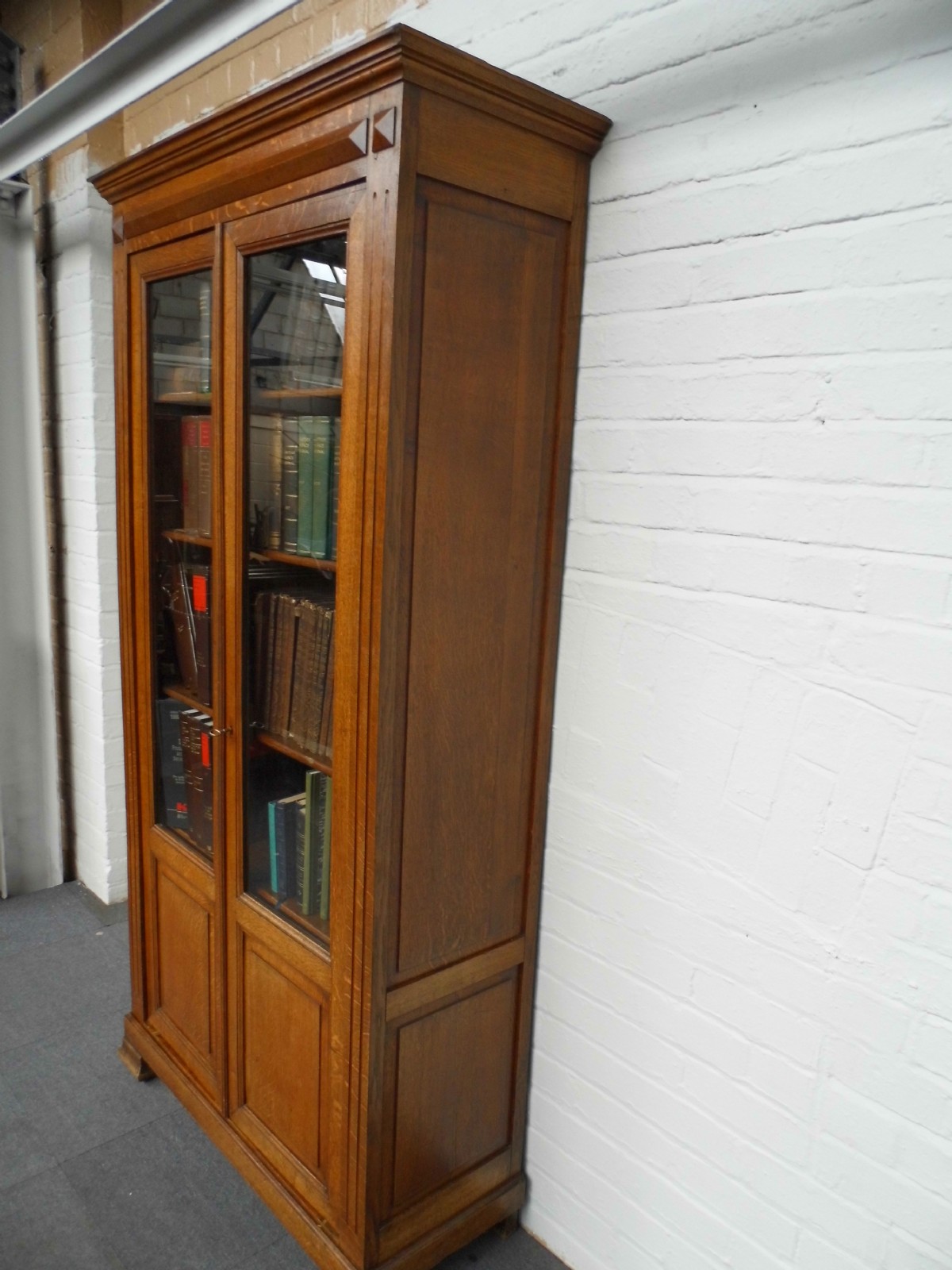  FRENCH OAK BOOKCASE WITH GLAZED DOORS AND PANELLED DOORS View II