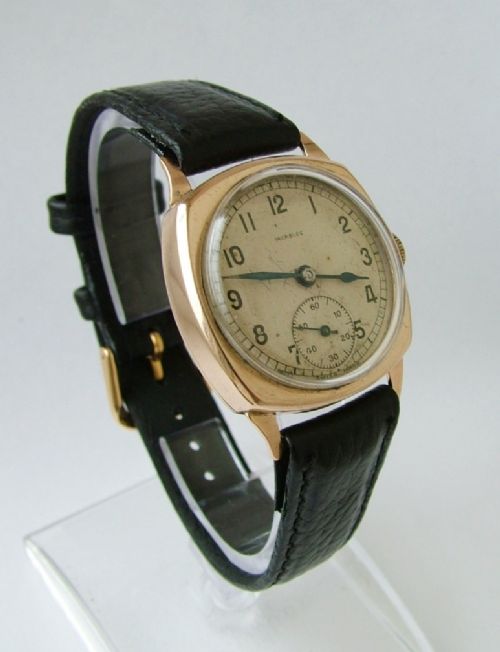 fig 1. Gents vintage 9ct gold cushion cased wrist watch