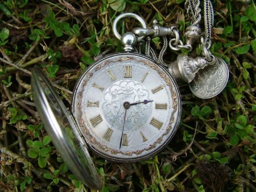 fig 1. Lady's antique fob watch and albertina