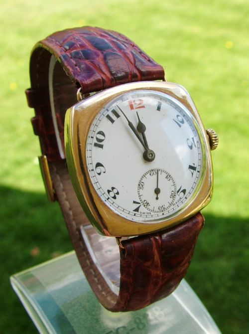 fig 1. Gents 1920s 9ct gold cushion cased wrist watch