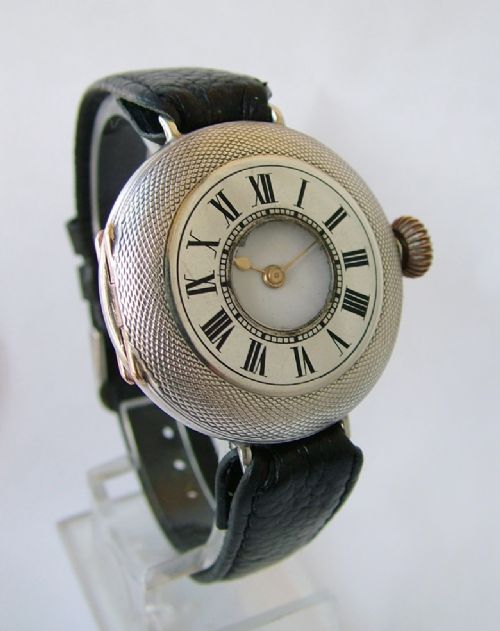 fig 1. Antique silver half hunter trench wrist watch