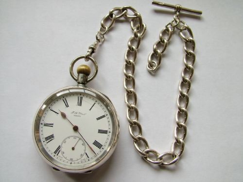 fig 1. Antique silver Omega pocket watch and chain