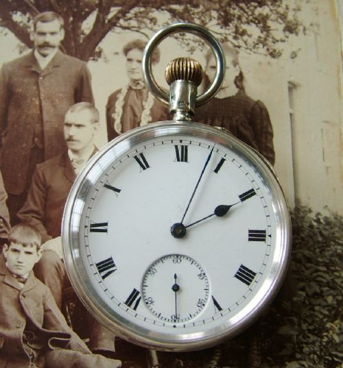 fig 1. Antique silver pocket watch and chain
