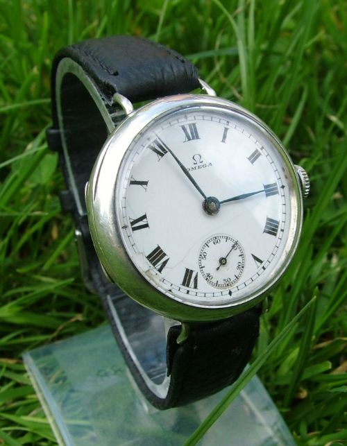 fig 1. Antique silver Omega trench watch