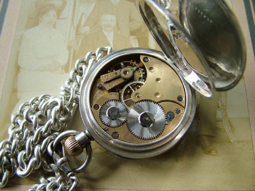 fig 1. Antique Omega pocket watch and chain