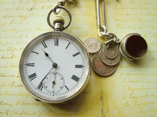 fig 1. Antique silver Omega pocket watch with chain