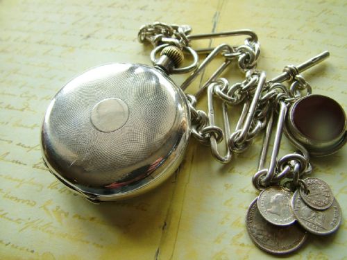 fig 2. Antique silver Omega pocket watch with chain