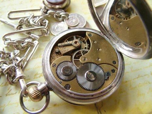 fig 3. Antique silver Omega pocket watch with chain