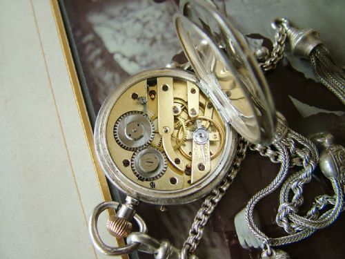 fig 2. A lady’s silver fob watch and albertina