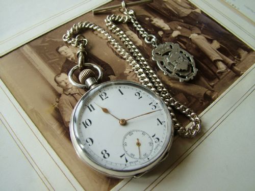 An Antique Pocket Watch and Chain, Circa 1910s