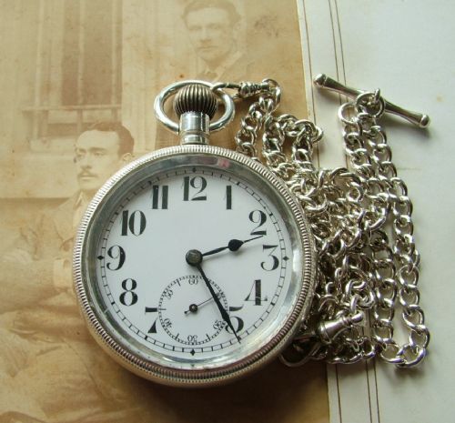 fig 1. An antique pocket watch and chain, circa 1910s