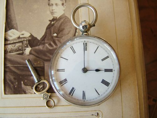 fig 1. An antique silver Longines pocket watch