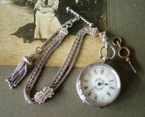 fig 1. A lady’s antique silver fob watch and albertina