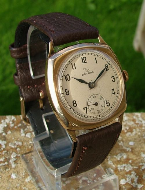 fig 1. Gents 9ct gold Record cushion cased wrist watch