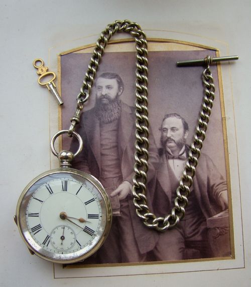 An Antique Key Winding Pocket Watch and Chain