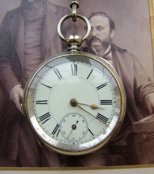 fig 1. An antique key winding pocket watch and chain