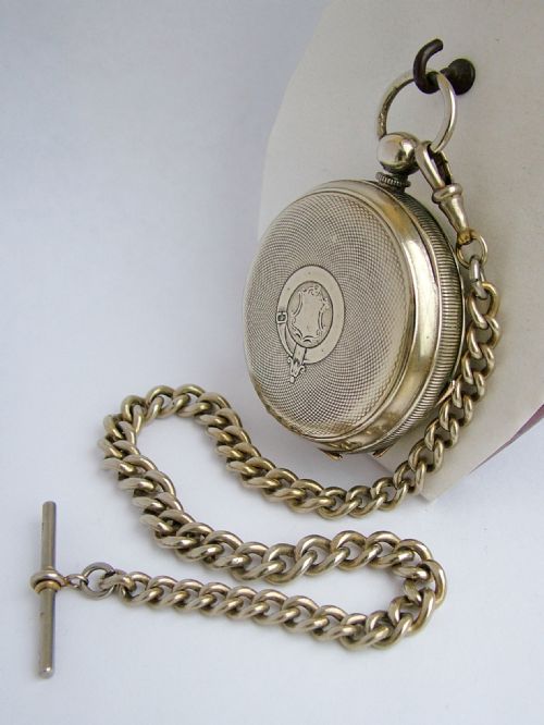 fig 2. An antique key winding pocket watch and chain