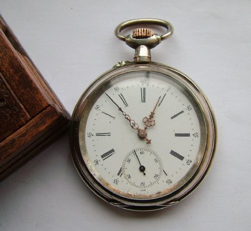 fig 2. An antique pocket watch in stand by Chopard