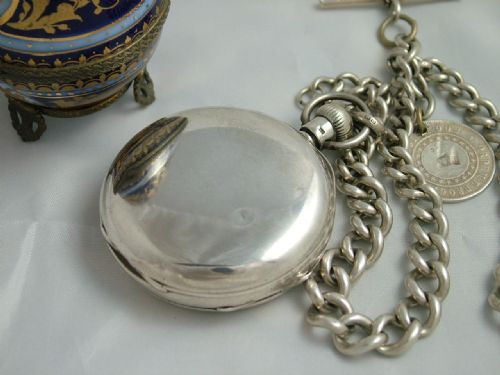 fig 1. An antique silver Waltham pocket watch and chain