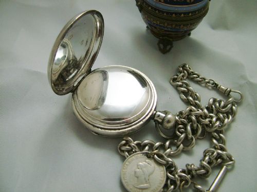 fig 2. An antique silver Waltham pocket watch and chain
