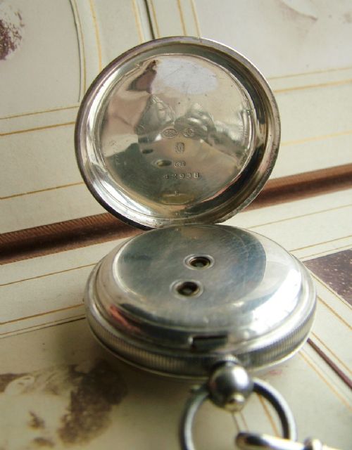 fig 2. An antique silver pocket watch and chain