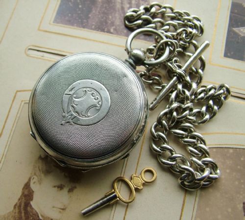 fig 3. An antique silver pocket watch and chain