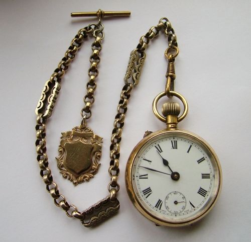 fig 1. An early 20th Century brass pocket watch and chain