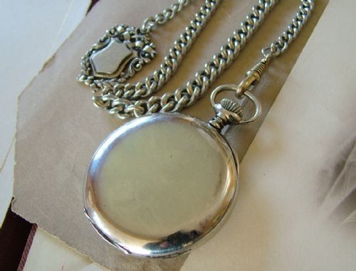 fig 2. A 1920s Longines pocket watch and chain