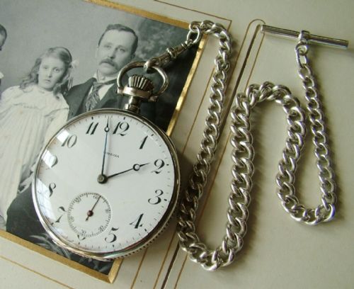 fig 1. Antique silver Omega pocket watch and chain