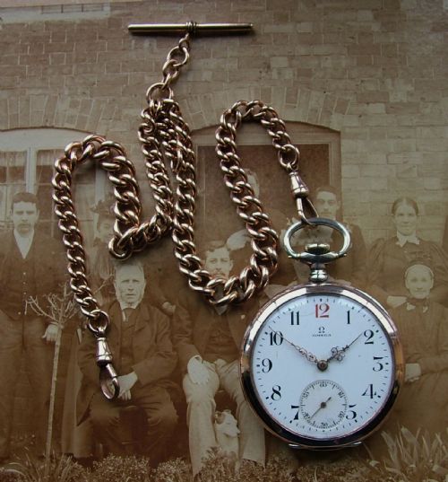 fig 1. An antique Omega pocket watch and double albert