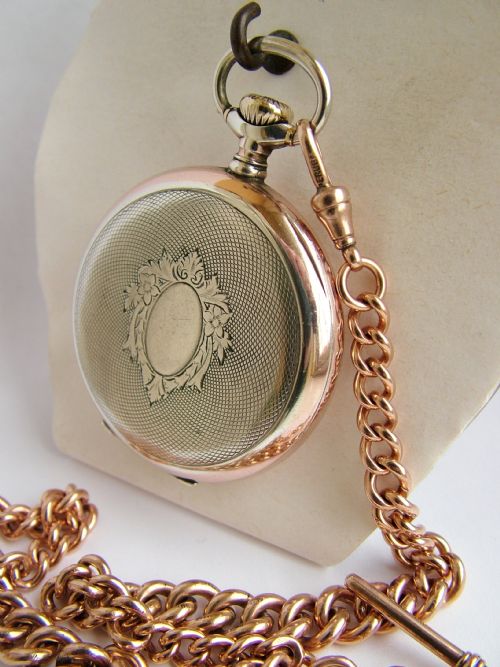 fig 2. An antique Omega pocket watch and double albert