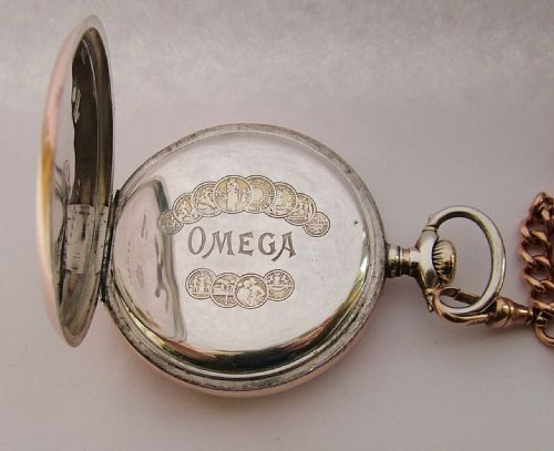 fig 3. An antique Omega pocket watch and double albert