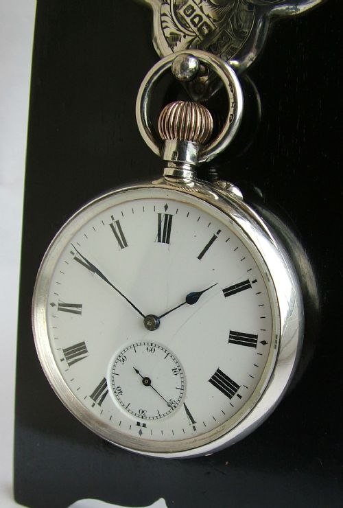 fig 1. Antique J.W.Benson silver pocket watch and stand