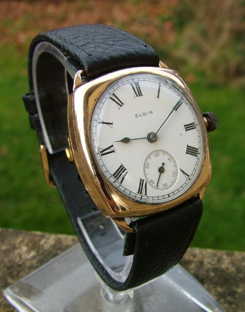 fig 1. An antique Elgin gents cushion cased wrist watch