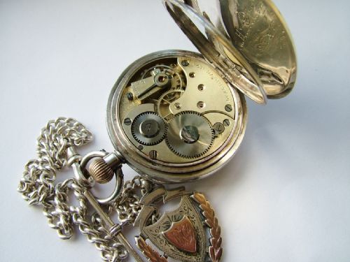 fig 3. Antique silver Omega pocket watch, chain and fob