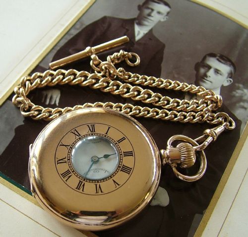 An Antique Half Hunter Pocket Watch and Chain
