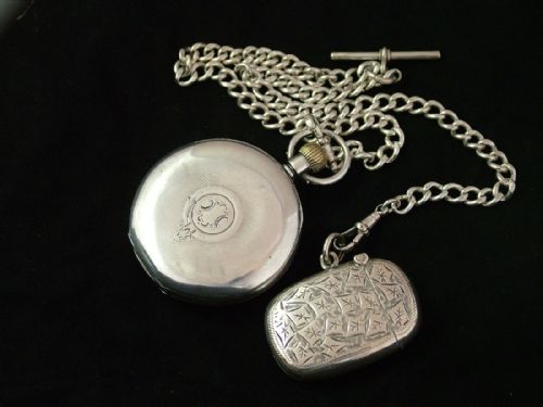 fig 1. Silver Perfecta pocket watch, albert and vesta