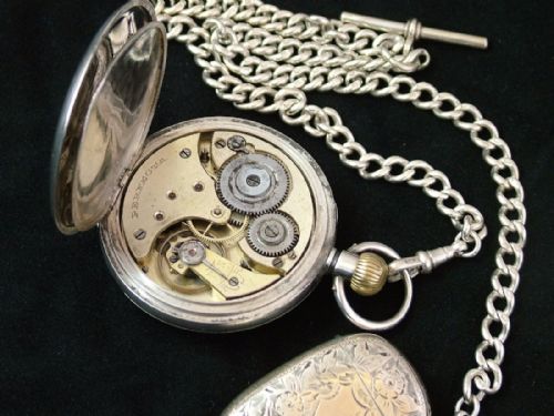 fig 3. Silver Perfecta pocket watch, albert and vesta