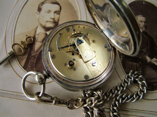 fig 1. An antique key-winding pocket watch with chain
