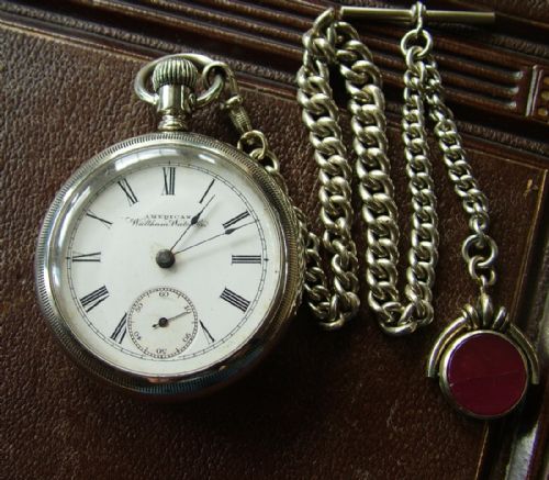 fig 1. An antique Waltham Sterling pocket watch and chain