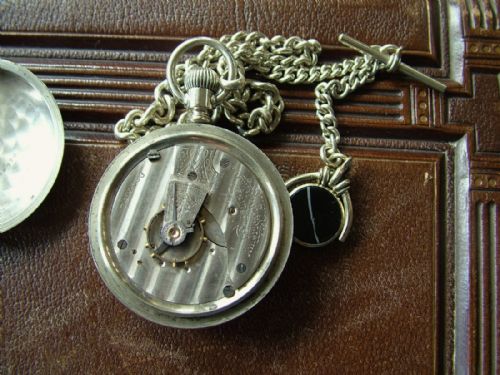 fig 2. An antique Waltham Sterling pocket watch and chain