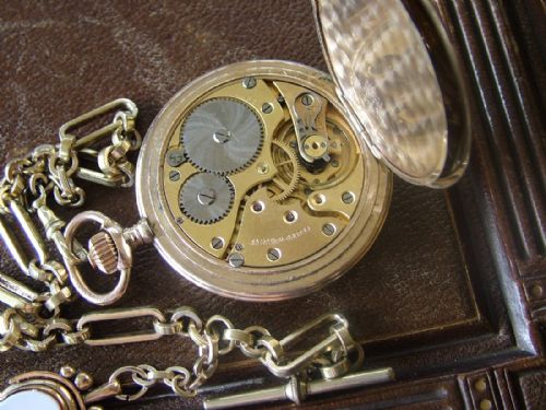 fig 2. A 1930s Record full hunter pocket watch and chain