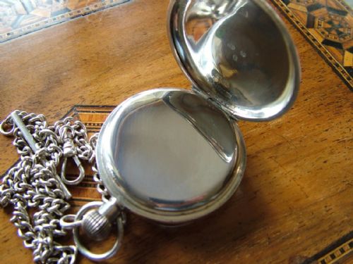 fig 1. An antique Swiss silver pocket watch and chain