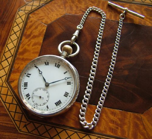 A World War 1 Era Silver Pocket Watch and Chain