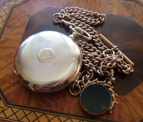 fig 2. An antique Omega pocket watch, chain and fob
