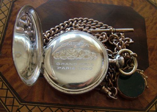 fig 3. An antique Omega pocket watch, chain and fob